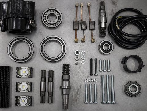Sorted bumper car spare parts on a workbench